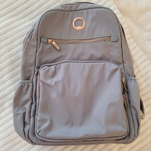 Delsey Gray Laptop Backpack with Rose Gold Zipper Accents